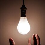 Imagery - Person Holding White Light Bulb