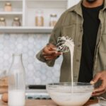 Consistency - A Man Checking the Texture of the Batter