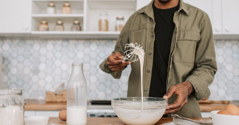 Consistency - A Man Checking the Texture of the Batter