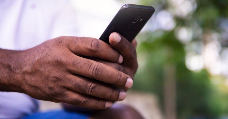 Mobile Viewing - Person Holding Black Android Smartphone