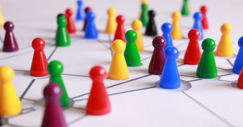 Interactive Features - Close Up Photography of Yellow Green Red and Brown Plastic Cones on White Lined Surface