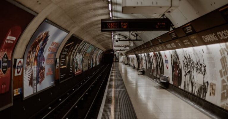 Hosting Platform - A subway station with a train and posters