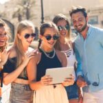 Share - Group of People Standing Beside Body of Water