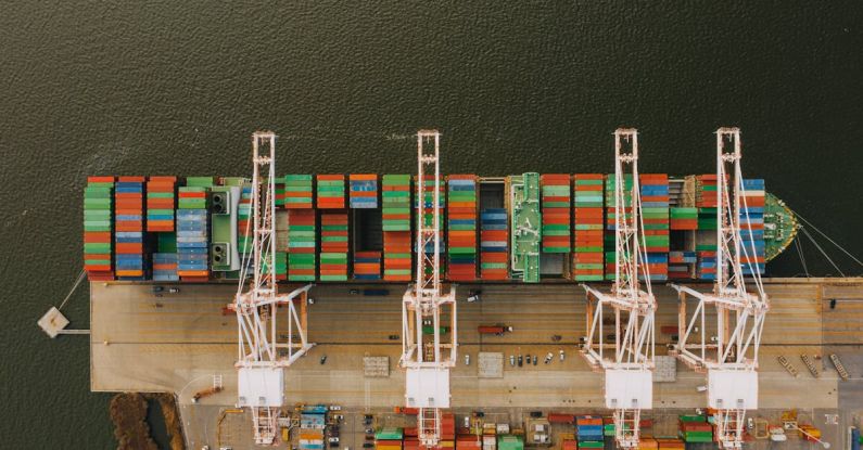 International Distribution - Colorful cargo containers on ship near pier