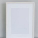Glossy Paper - Blank frame placed on round stand