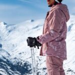 Call-to-Action - A person in pink ski gear standing on a snowy slope